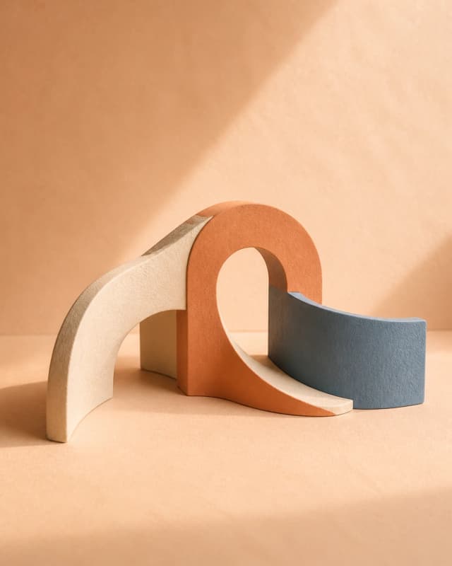 Interlocking tactile forms representing support issues moving through an operating system