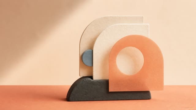 Layered tactile forms representing shared coaching and support improvement